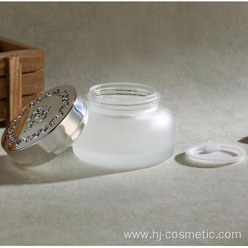 wholesales High-grade golden carved ABS cap transparent glass cosmetic bottles/jars with good price